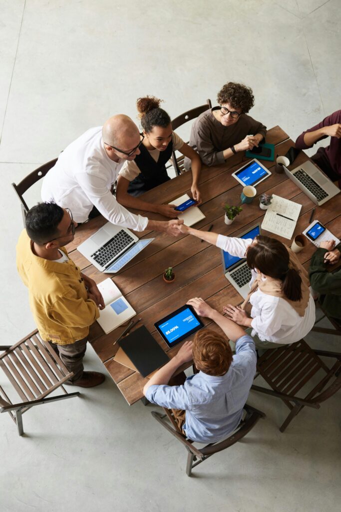 pexels photo 3183172 3183172 Overhead shot of a diverse team collaborating in a modern office meeting.